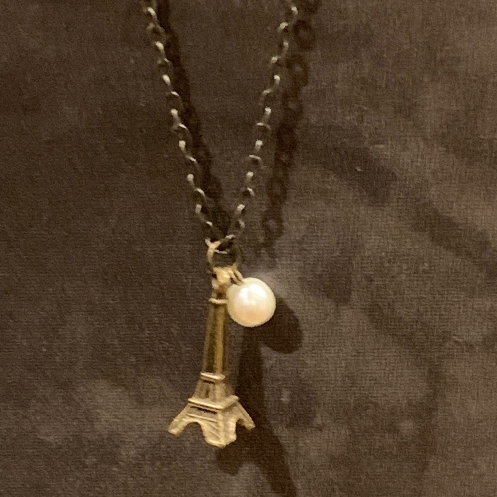 Antique brass Eiffel Tower and pearl necklace
